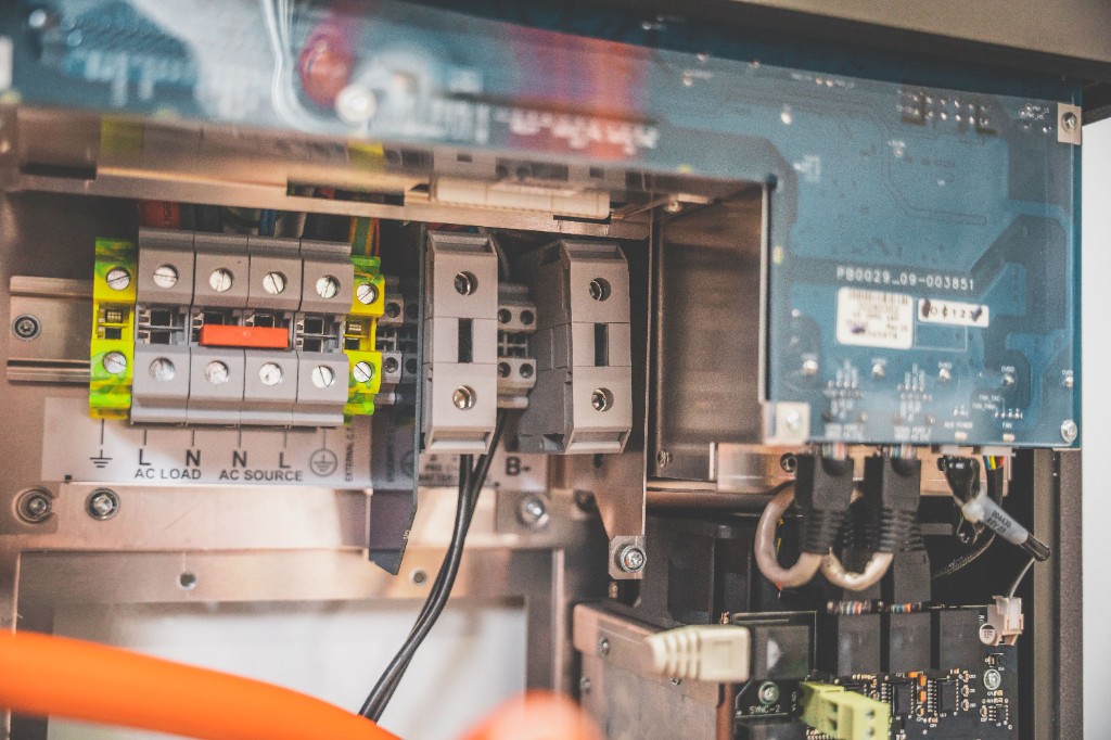 Electrical control panel internals with terminal blocks and circuit board